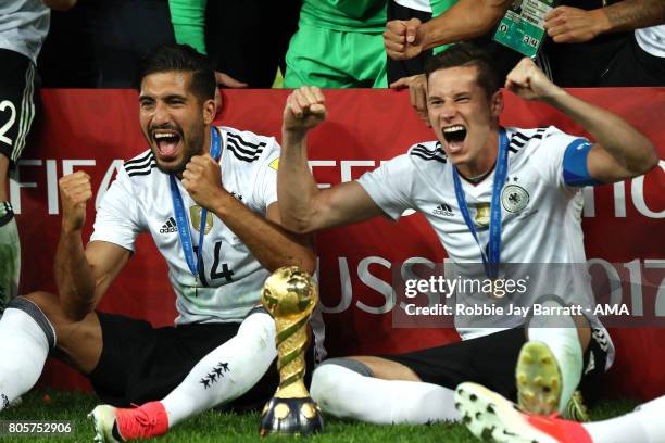 Julian Draxler and Emre Can of Germany celebrate with the trophy at the end of the FIFA Confederations Cup Russia 2017 Final match between Chile and...