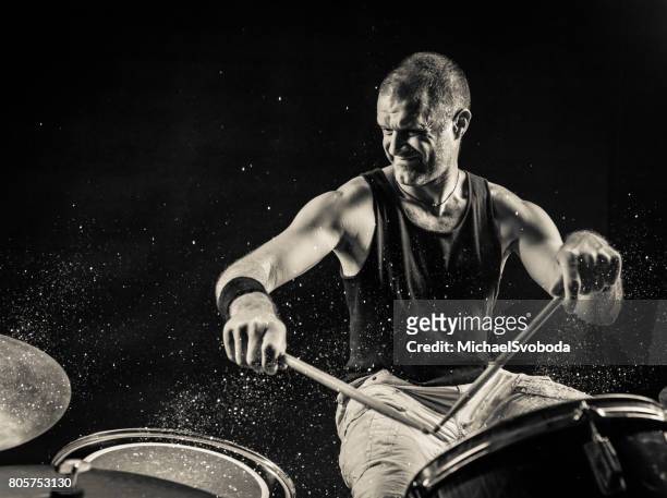 black and white rock n roll drummer - hitting drum stock pictures, royalty-free photos & images