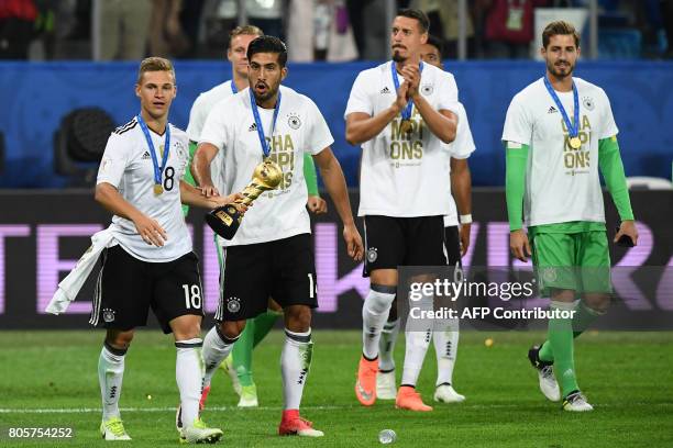 Germany's players pose with the trophy after winning the 2017 Confederations Cup final football match between Chile and Germany at the Saint...