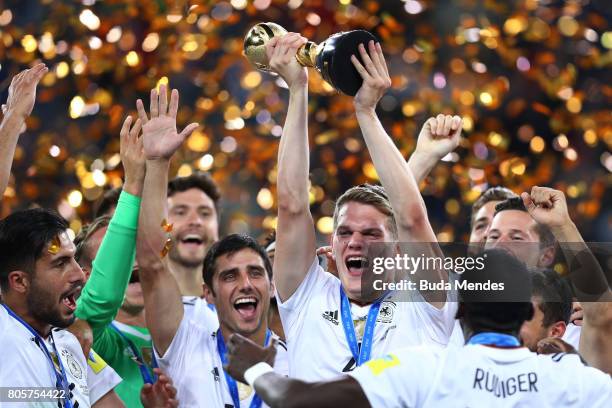 Matthias Ginter of Germany lifts the FIFA Confederations Cup trophy after the FIFA Confederations Cup Russia 2017 Final between Chile and Germany at...
