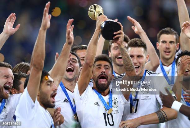 Kerem Demirbay of Germany lifts the FIFA Confederations Cup trophy after the FIFA Confederations Cup Russia 2017 Final between Chile and Germany at...