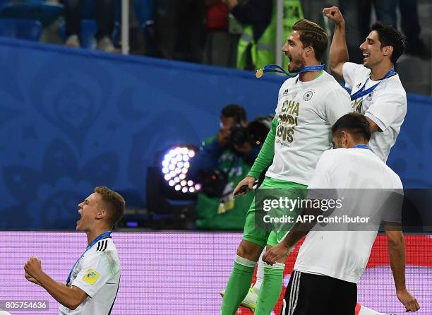 Germany's defender Joshua Kimmich and team mates celebrate after winning the 2017 Confederations Cup final football match between Chile and Germany...