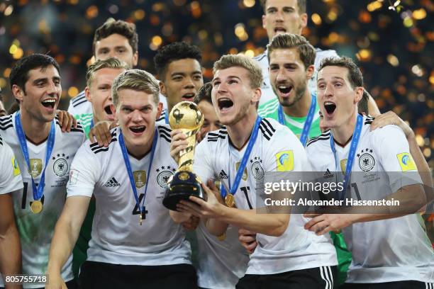 Timo Werner of Germany lifts the FIFA Confederations Cup trophy after the FIFA Confederations Cup Russia 2017 Final between Chile and Germany at...