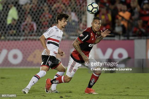 Guerrero of Flamengo battles for the ball with Rodrigo Caio of Sao Paulo during the match between Flamengo and Sao Paulo as part of Brasileirao...