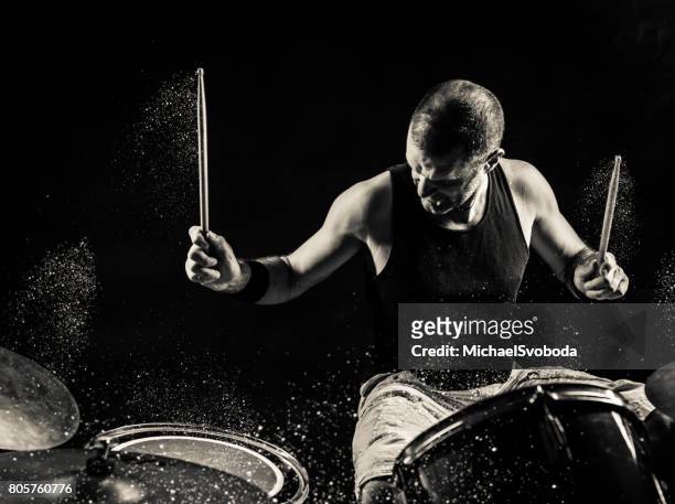 black and white rock n roll drummer - rock music stock pictures, royalty-free photos & images