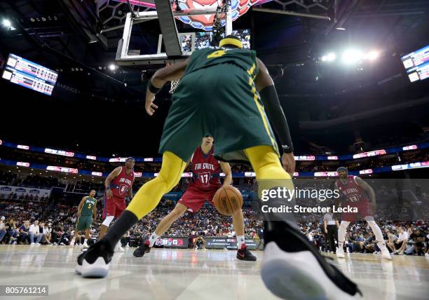 Derrick Byars of the Ball Hogs and Lou Amundson of Tri-State compete for the ball during week two of the BIG3 three on three basketball league at...