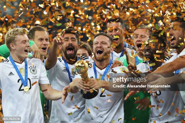 Shkodran Mustafi of Germany lifts the FIFA Confederations Cup trophy after the FIFA Confederations Cup Russia 2017 Final between Chile and Germany at...
