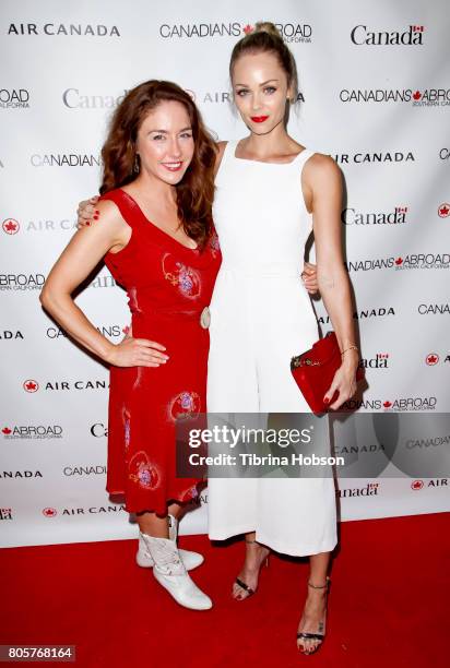 Erin Karpluk and Laura Vandervoort attend the 2017 Canada Day Celebration at Hard Rock Cafe Hollywood on July 1, 2017 in Hollywood, California.