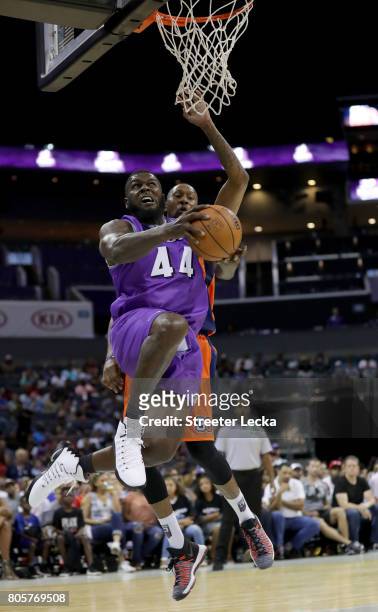 Ivan Johnson of the Ghost Ballers shoots a reverse layup during week two of the BIG3 three on three basketball league at Spectrum Center on July 2,...