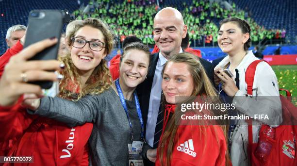 Fifa President Gianni Infantino poses for a selfie with volunteers after the FIFA Confederations Cup Russia 2017 Final match between Chile and...