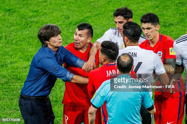 Germany Head Coach / Manager Joachim Loew clashes on the pitch with Gonzalo Jara of Chile during FIFA Confederations Cup Russia final match between...