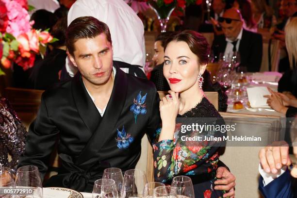 Ulyana Sergeenko and Guest attends the amfAR Paris Dinner 2017 at Le Petit Palais on July 2, 2017 in Paris, France.