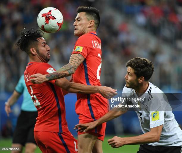Jonas Hektor of Germany in action against Mauricio Isla and Charles Aranguiz of Chile during the Confederations Cup 2017 Final match Chile - Germany...