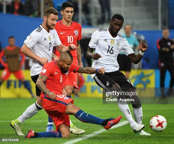 Antonio Ruediger and Shkodran Mustafi of Germany in action against Artudo Vidal of Chile during the Confederations Cup 2017 Final match Chile -...