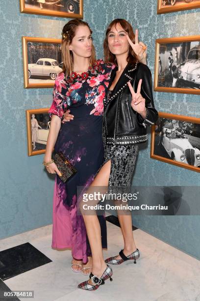 Sofia Sanchez de Betak and Alexa Chung attend Miu Miu Cruise Collection show as part of Haute Couture Paris Fashion Week on July 2, 2017 in Paris,...