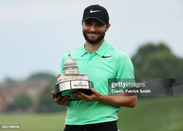 Kyle Stanley of the United States celebrates with the winner's trophy after defeating Charles Howell III of the United States during a playoff in the...