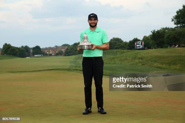 Kyle Stanley of the United States celebrates with the winner's trophy after defeating Charles Howell III of the United States during a playoff in the...