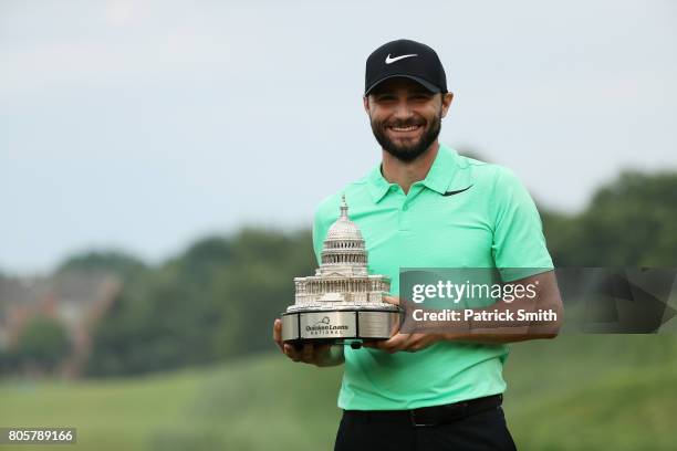 Kyle Stanley of the United States celebrates with the winner's trophy after defeating Charles Howell III of the United States during a playoff in the...