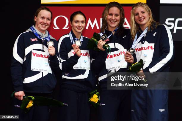 The United Kingdom team receives the silver medal in the Women's 4 x 200m Freestyle Final during the ninth FINA World Swimming Championships at the...