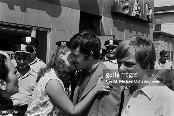 Fan gets through security to kiss Rick Huxley ofThe Dave Clark Five who are on a tour to promote their movie "Having A Wild Weekend" in August 1964...