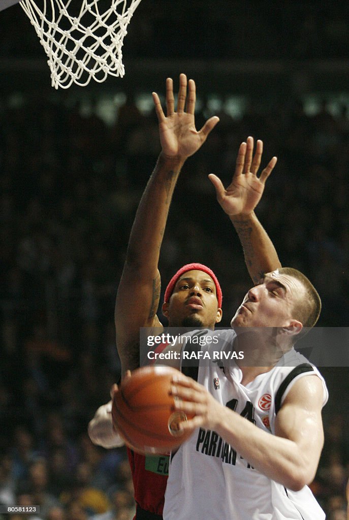 TAU Baskonia's Will McDonald (L) vies wi