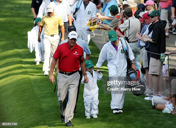 Phil Mickelson walks with his son Evan during the Par 3 Contest prior to the start of the 2008 Masters Tournament at Augusta National Golf Club on...