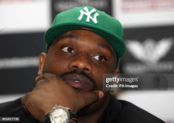 Dereck Chisora waits as Danny Williams fails to turn up for the press conference at the Landmark Hotel, London.