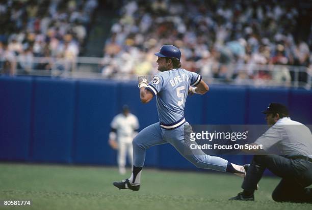S: Third baseman George Brett of the Kansas City Royals races to second base against the New York Yankees during a circa 1980's Major League baseball...