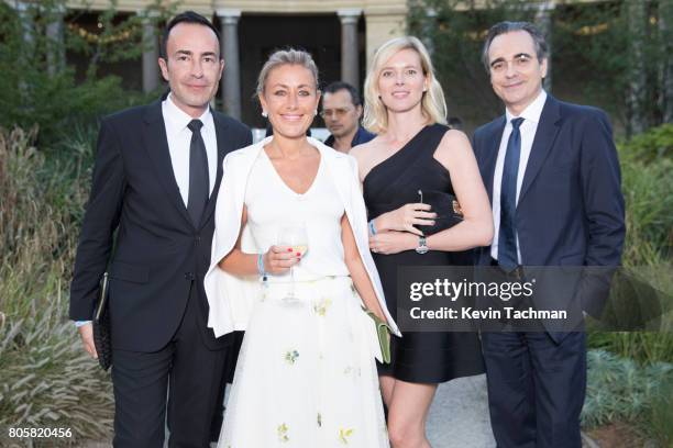 Michael Coste, Claire Duroc Danner and guests arrive for the amfAR Paris Dinner at Le Petit Palais on July 2, 2017 in Paris, France.