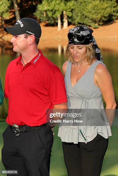 Rory Sabbatini of South Africa and his wife Amy pose with the trophy after winning the Par 3 Contest prior to the start of the 2008 Masters...