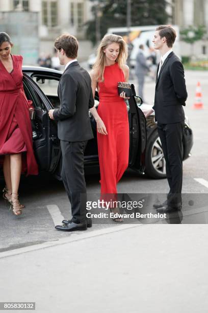 Iris Van Berne wears a red dress, outside the amfAR dinner at Petit Palais, during Paris Fashion Week - Haute Couture Fall/Winter 2017-2018, on July...