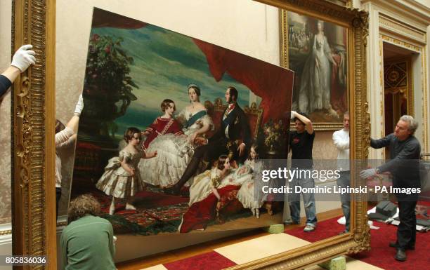 Conservators of the Royal Collection move 'The Royal Family in 1846' by Franz Xaver Winterhalter from the East Gallery of Buckingham Palace as part...