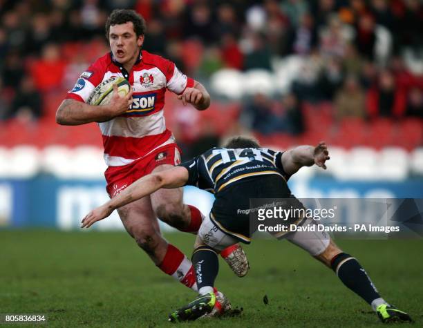 Gloucester's Tim Molenaar is tackled by Worcester's Chris Pennell during the LV= Cup match at Kingsholm Stadium, Gloucester.