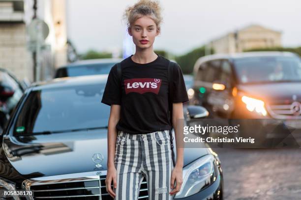 Model wearing a Levis shirt outside Miu Miu Cruise Collection during Paris Fashion Week - Haute Couture Fall/Winter 2017-2018 : Day One on July 2,...