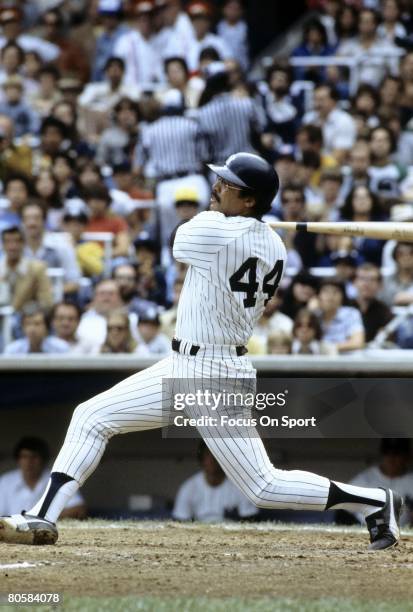 S: Outfielder Reggie Jackson of the New York Yankees swings and watches the flight of his ball during a circa late 1970's game at Yankee Stadium in...