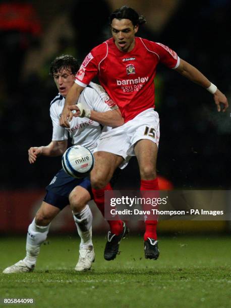 Preston's Billy Jones and Barnsley's Auderson De-Silva battle for the ball during the Coca-Cola Football League Championship match at Deepdale,...