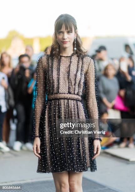 Stacy Martin wearing a sheer dress outside Miu Miu Cruise Collection during Paris Fashion Week - Haute Couture Fall/Winter 2017-2018 : Day One on...