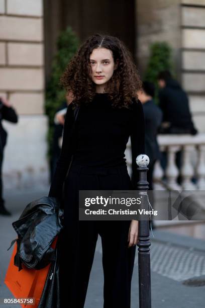 Model outside Miu Miu Cruise Collection during Paris Fashion Week - Haute Couture Fall/Winter 2017-2018 : Day One on July 2, 2017 in Paris, France.