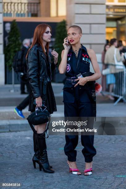 Model Teddy Quinlivan and Adwoa Aboah outside Miu Miu Cruise Collection during Paris Fashion Week - Haute Couture Fall/Winter 2017-2018 : Day One on...