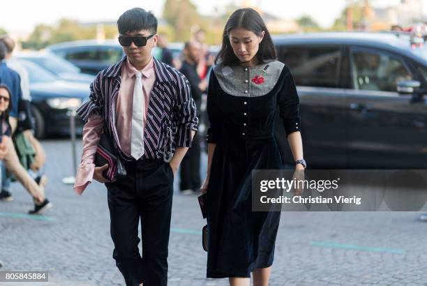 Declan Chan and Justine Lee outside Miu Miu Cruise Collection during Paris Fashion Week - Haute Couture Fall/Winter 2017-2018 : Day One on July 2,...