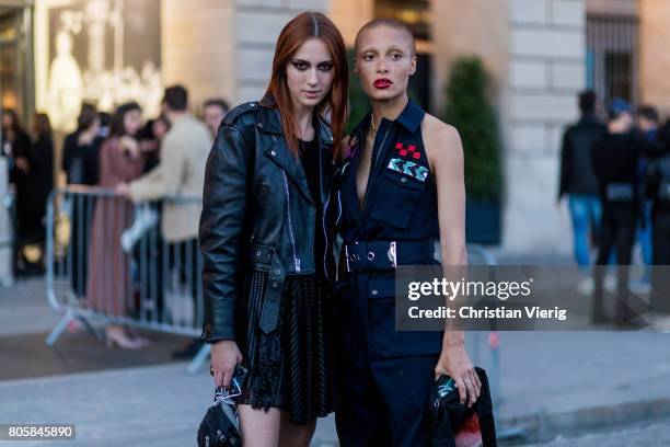 Model Teddy Quinlivan and Adwoa Aboah outside Miu Miu Cruise Collection during Paris Fashion Week - Haute Couture Fall/Winter 2017-2018 : Day One on...
