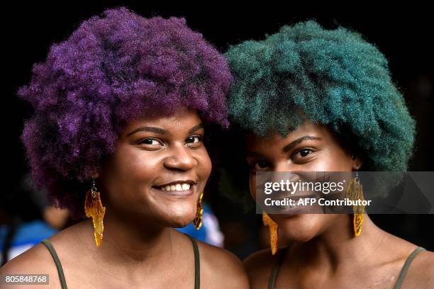 Two young women show Afro-Colombian hairstyles during the 13th contest of Afro hairdressers "Tejiendo Esperanzas" in Cali, Valle del Cauca...