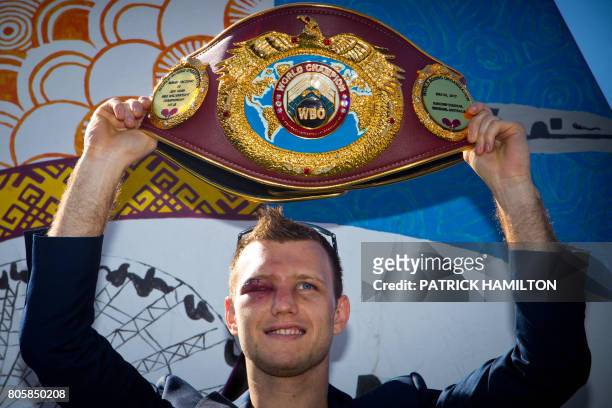 Newly crowned World Boxing Organization welterweight champion Jeff Horn of Australia poses for photographs with his belt during a press conference in...