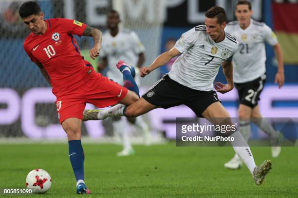 Pablo Hernandez of the Chile national football team and Julian Draxler of the Germanyl national football team vie for the ball during the 2017 FIFA...