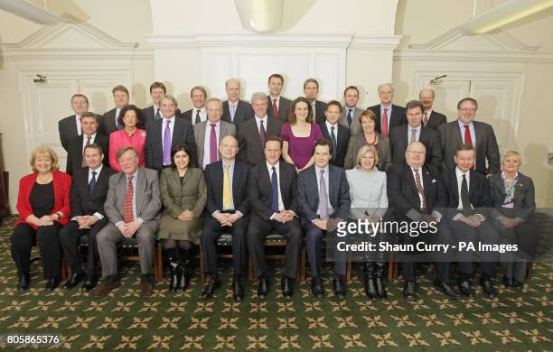 Members of the British government shadow cabinet pose for a family photo in central London, David Mundell, Lord Strathclyde, Greg Clark, Owen...