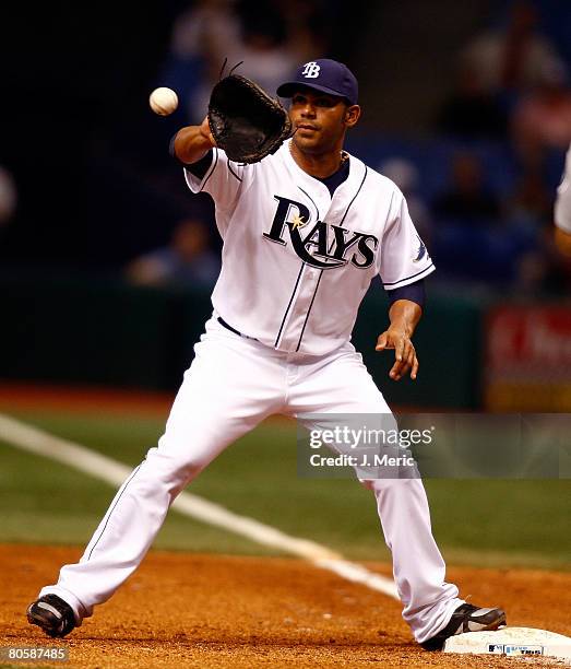 Carlos Pena of the Tampa Bay Rays takes the throw at first against the Seattle Mariners April 9, 2008 at Tropicana Field in St. Petersburg, Florida.