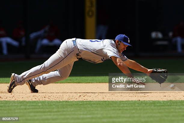 Third baseman Blake Dewitt of the Los Angeles Dodgers dives but can't come up with the ball, a single by Chris Burke of the Arizona Diamondbacks in...