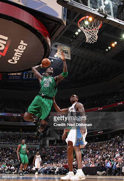 Kevin Garnett of the Boston Celtics goes up for a dunk against Antawn Jamison of the Washington Wizards at the Verizon Center on April 9, 2008 in...