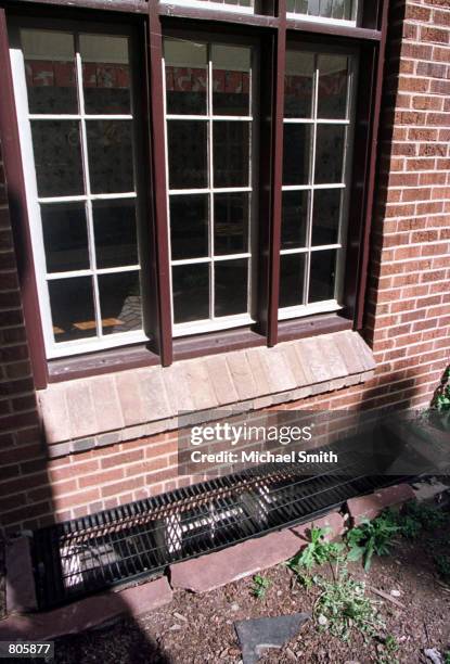 Grate covers a basement window at the home of John and Patsy Ramsey April 30, 2001 in Boulder, CO. Retired investigator, Lou Smit, who was involved...