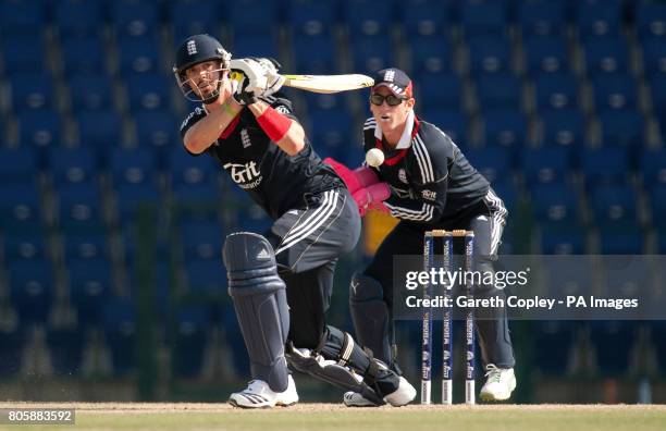 England's Kevin Pietersen hits out watched by England Lions wicketkeeper Craig Kieswetter during International Twenty20 Friendly at the Dubai Sports...